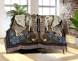 Lim Elephant Cotton Blend Blanket Throw in Black, Green and Yellow, on a bed