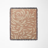 Nami Abstract Floral Blanket Throw in Rust and Beige, laid flat