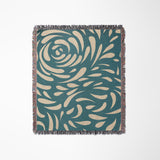 Nami Abstract Floral Blanket Throw in Teal and Beige, laid flat