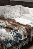 Piya Peacock Cotton Blend Blanket Throw in Burnt Orange, on a bed