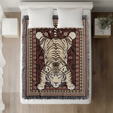 Roy Tiger Cotton Blend Blanket Throw in Red, on a bed