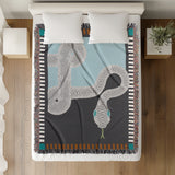 Sami Snake Cotton Blend Blanket Throw in Gray and Blue, on a bed