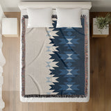 Shako Southwestern Cotton Blend Blanket Throw in Blue and Off-White, on a bed