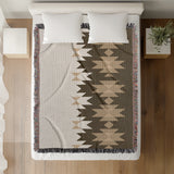 Shako Southwestern Cotton Blend Blanket Throw in Brown and Off-White, on a bed