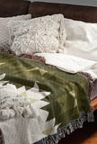 Shako Southwestern Cotton Blend Blanket Throw in Chartreuse and Off-White, draped over a chair