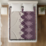 Shako Southwestern Cotton Blend Blanket Throw in Purple and Off-White, on a bed