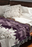 Shako Southwestern Cotton Blend Blanket Throw in Purple and Off-White, draped over a chair