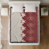 Shako Southwestern Cotton Blend Blanket Throw in Red and Off-White, on a bed
