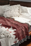 Shako Southwestern Cotton Blend Blanket Throw in Red and Off-White, draped over a chair
