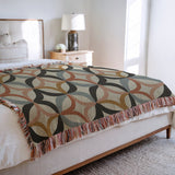 Spectra Cotton Blend Blanket Throw in Black, on a bed