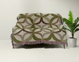 Spectra Cotton Blend Blanket Throw in Chartreuse, draped over a chair