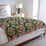 Spectra Cotton Blend Blanket Throw in Green, on a bed
