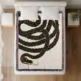 Spiga Snake Cotton Blend Blanket Throw in Black, on a bed