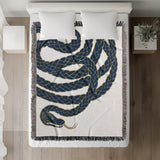 Spiga Snake Cotton Blend Blanket Throw in Blue, on a bed