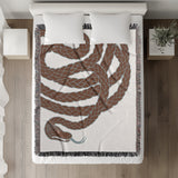Spiga Snake Cotton Blend Blanket Throw in Burnt Orange, on a bed