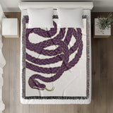 Spiga Snake Cotton Blend Blanket Throw in Purple, on a bed