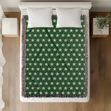 Stella Cotton Blend Blanket Throw in Green and Off-White, on a bed