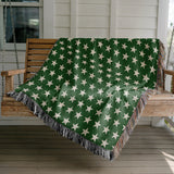 Stella Cotton Blend Blanket Throw in Green and Off-White, draped over a chair