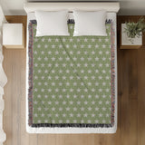 Stella Cotton Blend Blanket Throw in Mint and Off-White, on a bed