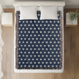 Stella Cotton Blend Blanket Throw in Navy Blue and Off-White, on a bed