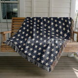 Stella Cotton Blend Blanket Throw in Navy Blue and Off-White, draped over a chair