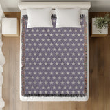 Stella Cotton Blend Blanket Throw in Periwinkle and Off-White, on a bed