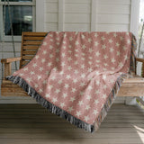 Stella Cotton Blend Blanket Throw in Pink and Off-White, draped over a chair