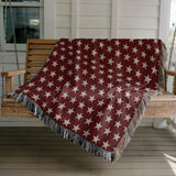 Stella Cotton Blend Blanket Throw in Red and Off-White, draped over a chair