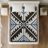 Tala Southwestern Cotton Blend Blanket Throw in Blue, Black and Off-White, on a bed