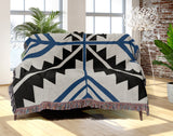 Tala Southwestern Cotton Blend Blanket Throw in Blue, Black and Off-White, draped over a chair