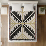 Tala Southwestern Cotton Blend Blanket Throw in Black, Dull Gold and Off-White, on a bed