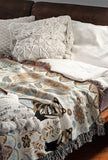 Tia Folksy Tiger Cotton Blend Blanket Throw in Black, Brown, Beige and Off-White, on a bed