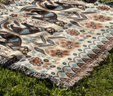 Tia Folksy Tiger Cotton Blend Blanket Throw in Black, Brown, Beige and Off-White, draped over a chair