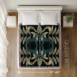 Tuk Leopard Cotton Blend Blanket Throw in Black, Teal and Green, laid flat