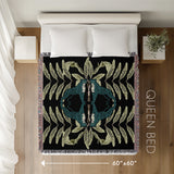 Tuk Leopard Cotton Blend Blanket Throw in Black, Teal and Green, laid flat