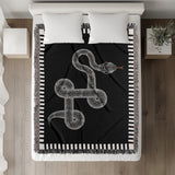 Vanjo Snake Cotton Blend Blanket Throw in Black and Off-White, on a bed