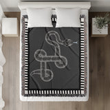Vanjo Snake Cotton Blend Blanket Throw in Gray, Black and Off-White, on a bed