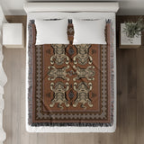 Voha Tibetan Tiger Cotton Blend Blanket Throw in Orange, Beige and Burnt Orange, on a bed