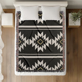 Wapi Southwestern Cotton Blend Blanket Throw in Black and Off-White, on a bed