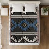 Wapi Southwestern Cotton Blend Blanket Throw in Blue, Black and Off-White, on a bed