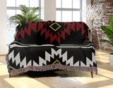Wapi Southwestern Cotton Blend Blanket Throw in Red, Black and Off-White, draped over a chair