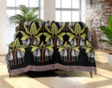 Xavier Zebra Cotton Blend Blanket Throw in Black and Chartreuse, draped over a chair