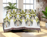 Xavier Zebra Cotton Blend Blanket Throw in Black, Chartreuse and Off-White, draped over a chair