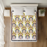 Xavier Zebra Cotton Blend Blanket Throw in Black, Yellow Green and Off-White, on a bed