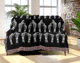 Ziggy Zebra Cotton Blend Blanket Throw in Black and Off-White, on a bed