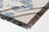 Ziggy Zebra Cotton Blend Blanket Throw in Blue and Off-White, draped over a chair