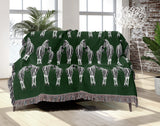 Ziggy Zebra Cotton Blend Blanket Throw in Green and Off-White, on a bed