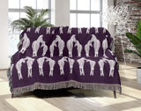 Ziggy Zebra Cotton Blend Blanket Throw in Purple and Off-White, on a bed