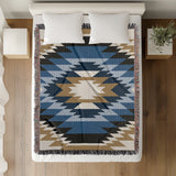 Zio Southwestern Cotton Blend Blanket Throw in Blue, Off-White and Dull Gold, on a bed