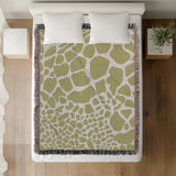 Zuma Animal Print Cotton Blend Blanket Throw in Chartreuse, on a bed